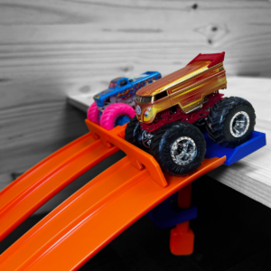 This is a 4 Lane Start Gate Compatible with Hot Wheels Cars and Track. It also supports 2 1/64 Scale Monster Jam and Hot Wheels Monster Trucks. It's made from environmetally friendly PLA Plastic by a small business based in the USA
