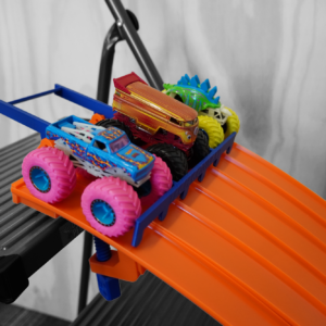 Fully assembled 6 Lane Raceway Starter Set compatible with Hot Wheels and Monster Trucks, featuring eco-friendly PLA plastic construction by QuirkWorks 3D