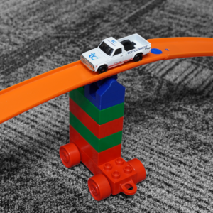 Eco-friendly Lego Duplo to Hot Wheels Track Connector made from PLA plastic, designed for creative play