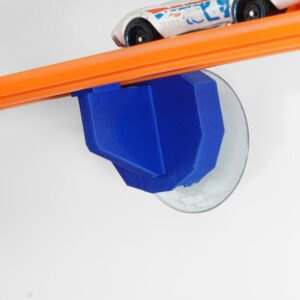 Hot Wheels Compatible Suction Cup Track Mount securely attached to a window, demonstrating stable and versatile track placement