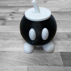 Bob-omb game holder Nintendo Switch cartridge storage Mario themed game case Cute Nintendo accessory Game cartridge organizer Bob-omb decor Mario gift idea Gaming accessory storage Nintendo Switch storage solution Bob-omb cartridge organizer