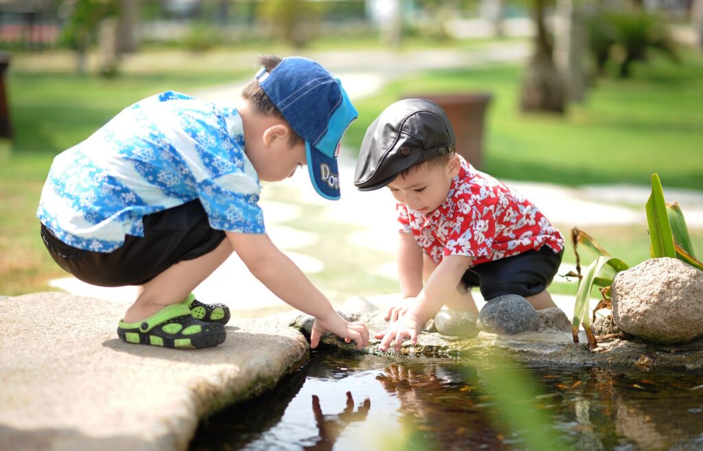 Play in Emotional and Social Development - Kids playing outside, face to face with no screentime