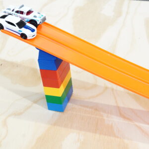 Hot Wheels Track Connector angled at 45 degrees, works with Lego Duplo Bricks for building ramps and jumps