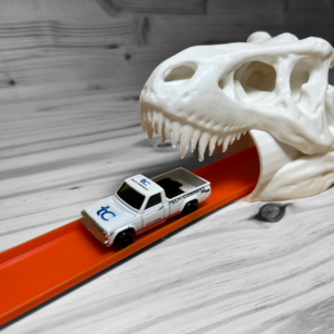 Dinosaur Tunnel for Hot Wheels, made in the USA with eco-friendly plastic, perfect for imaginative play and thrilling races.