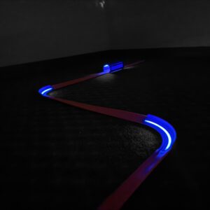 Hot Wheels Compatible Glow Track Set with glow-in-the-dark turns, tunnel, and sticks, made from eco-friendly PLA Plastic in the USA