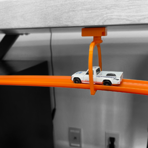 Hot Wheels Compatible Ceiling Mount with pivoting support for aerial car racing, designed to attach tracks to ceilings or flat surfaces using 3M tape or screws