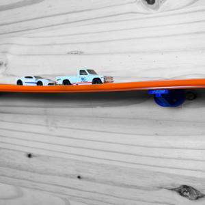 Two Lane Wall Mounted Track in action with Hot Wheels cars racing side by side on a wall.