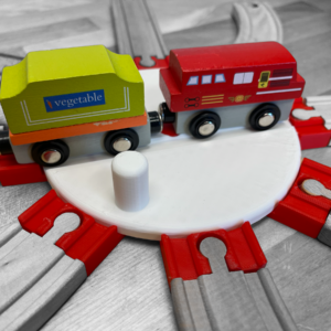 Image of a Wooden Train Turntable compatible with Brio, Lullabo, Thomas the Tank, and Ikea train sets. The turntable is crafted from high-quality wood, showcasing a smooth, rotating platform designed for easy direction changes in a child's train layout