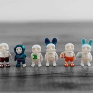 Set of 6 articulating mini skeletons, each with unique outfits for various occasions, made from eco-friendly materials, perfect for Halloween and creative decor