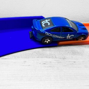 Hot Wheels Track 90 Degree Turn with 30-degree bank, made in the USA with eco-friendly plastic for tighter, faster racing fun